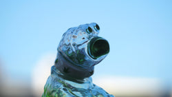 A glass creature, BONG A-MON, with a green mouth and neck, made of sofubi/resin, 9 cm tall. From Strangecat Toys, a blind box and art toy store.