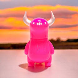 A pink toy sky monster by Chishima Konosuke, part of the Japanese Sofubi collection at Strangecat Toys.