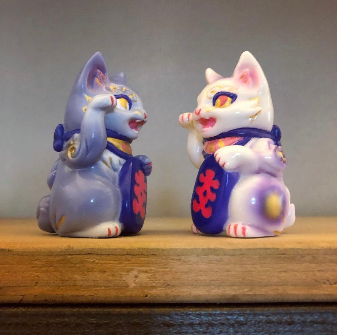 Two sitting cat figurines, Bake Lucky Cat - Taro by Genkosha, made of soft vinyl, 7cm in height.