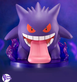 Pokémon Gengar Figurine, a cartoon character with tongue out, eye detail, and pointy object close-ups.