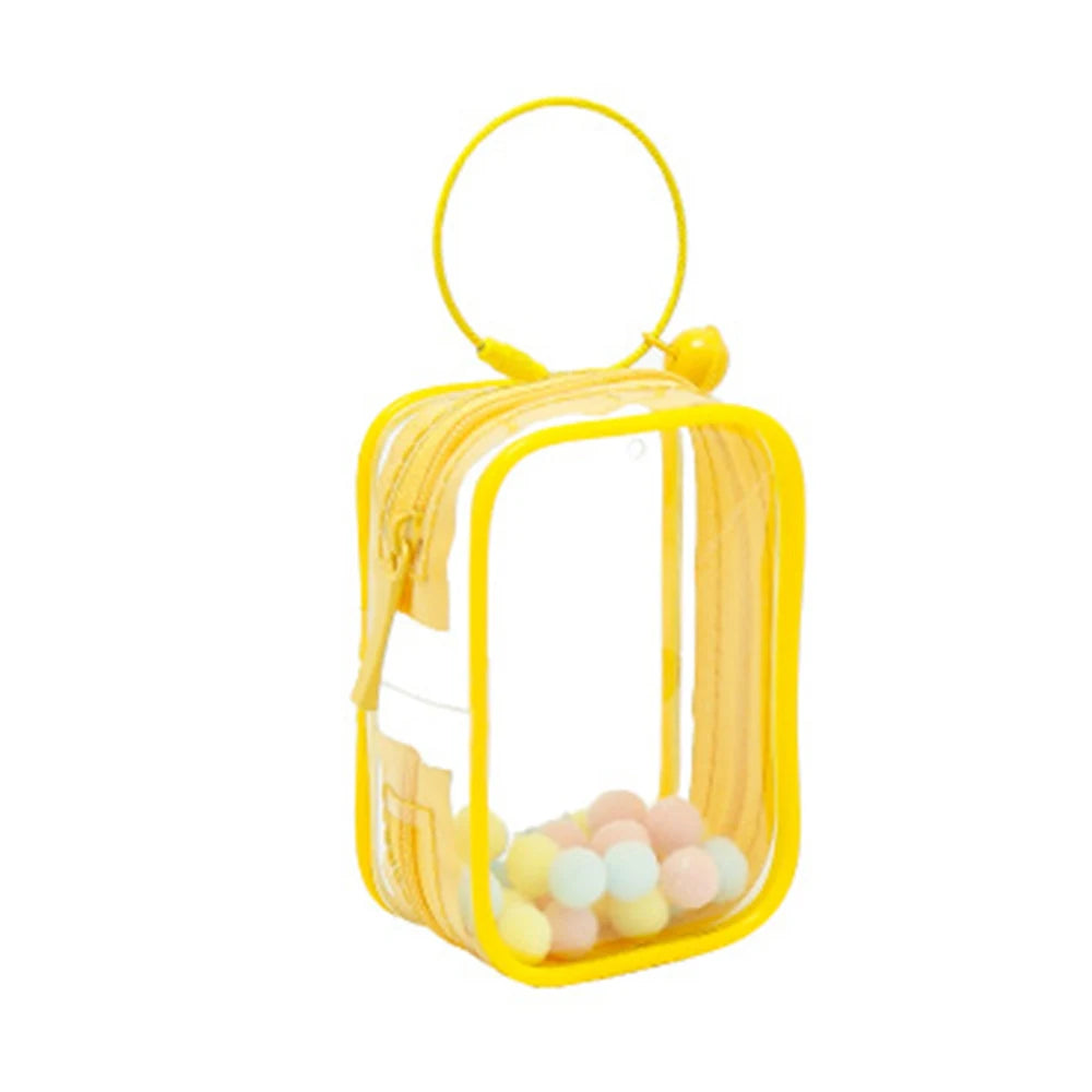 Toy Pochette Keychain featuring a small yellow object inside a yellow transparent bag, perfect for displaying dolls, comes with bells and keyring.