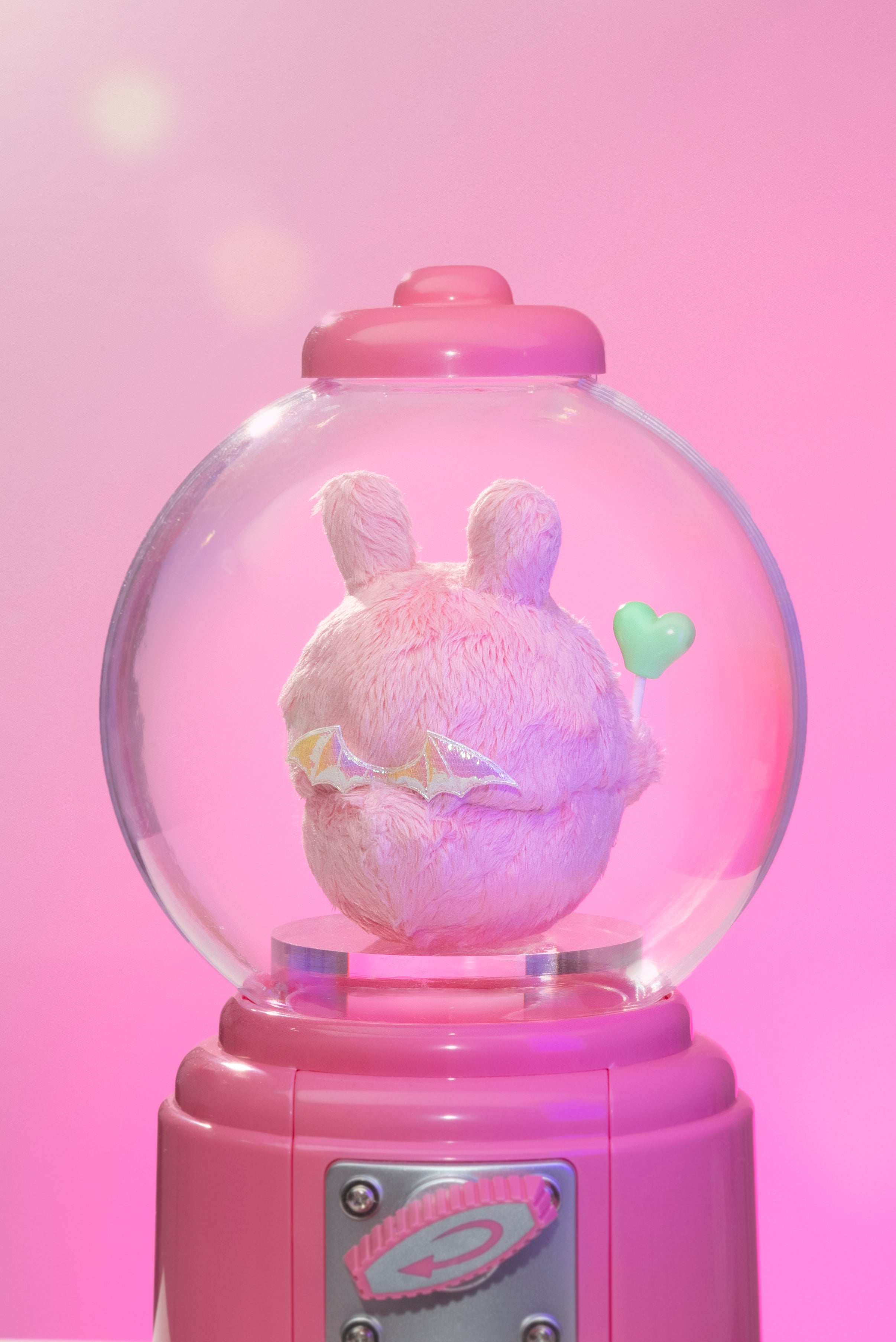 Sweet Death by Shinwoo: A baby pink stuffed animal with wings enclosed in a snow globe, crafted from resin and artificial fur, 11cm tall.