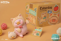 A toy pig transforms into a cat, playing with a ball of yarn and waving its paw. Includes LuLu The Piggy Caturday XL Cat Paws and accessories.