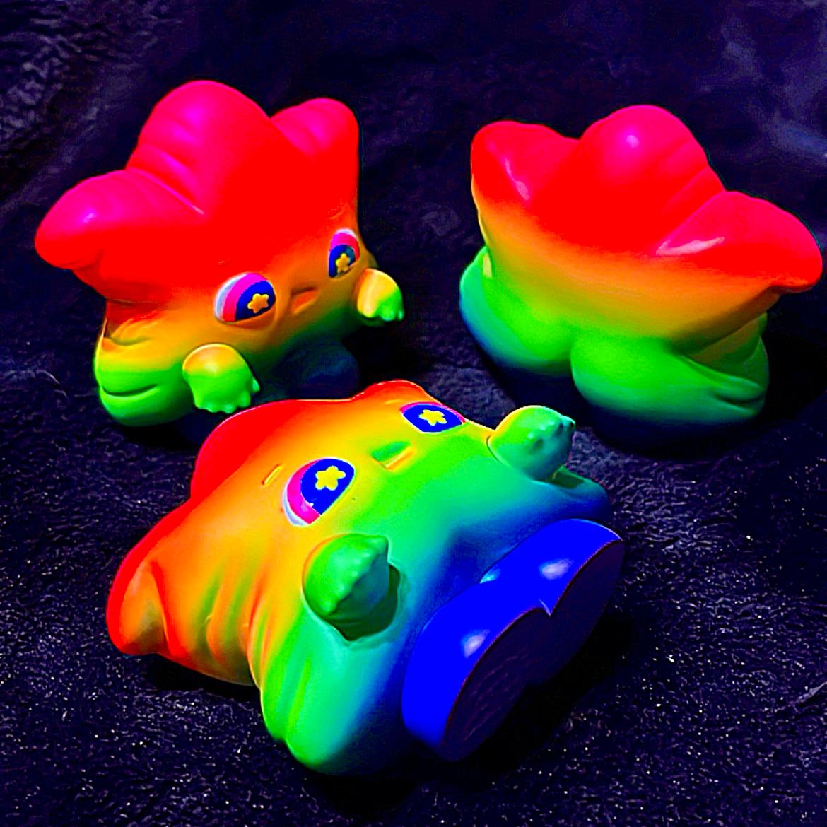 Rainbow Weee baby toy with star and animal figure, part of a group of baby toys.