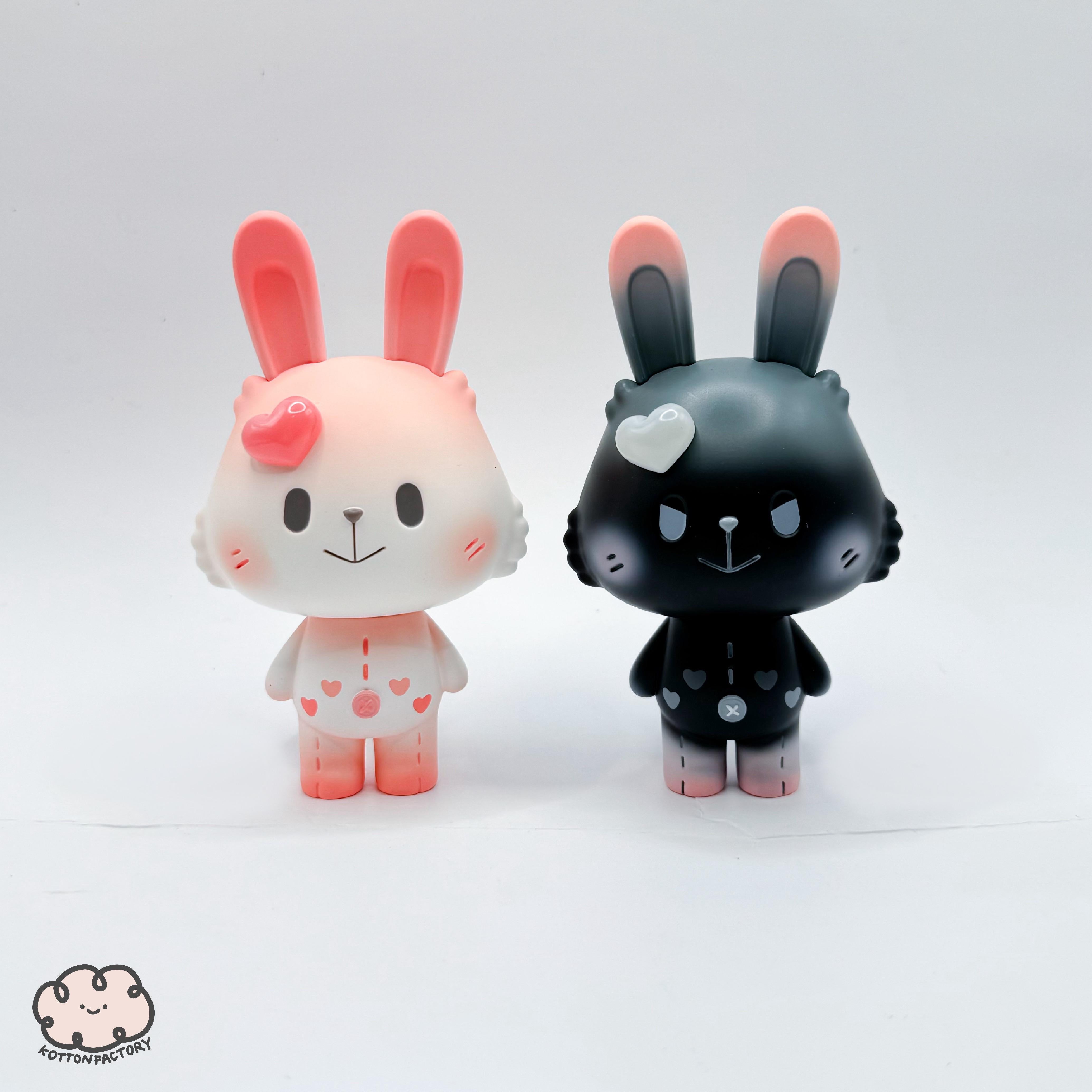 Valentine Robin toy figurines, featuring a black and a white-pink rabbit design, made of resin, part of a limited preorder collection by Kotton Factory.