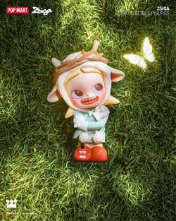 Blind box series preorder: Zsiga Let It Be Box Series - Preorder. Features toy on grass, white butterfly, toy animal. 12 regular designs, 1 secret. From Strangecat Toys.