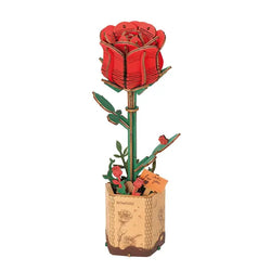 Wooden 3D puzzle of a red rose in a pot, inspired by blooming flowers. 96pcs, 30min assemble. Natural wood material. Ideal for decor or gifting. Dimensions: 9.6 x 6.5 x 0.3 in.