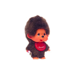 Monchhichi Mini Doll with red bib and pacifier, a blind box surprise from Strangecat Toys. Detailed close-up of toy animal with red bib and red circle stitching.