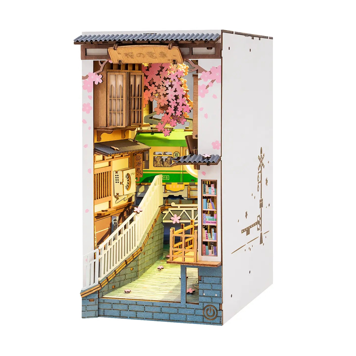 A miniature Sakura Tram Book Nook kit for adults, featuring a detailed house model with a staircase and bookcase, ideal for art toy enthusiasts.