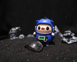 Space Hogkey Blue ver. - Preorder; a 9cm resin toy with large eyes, shown in a blue garment, available from Strangecat Toys.