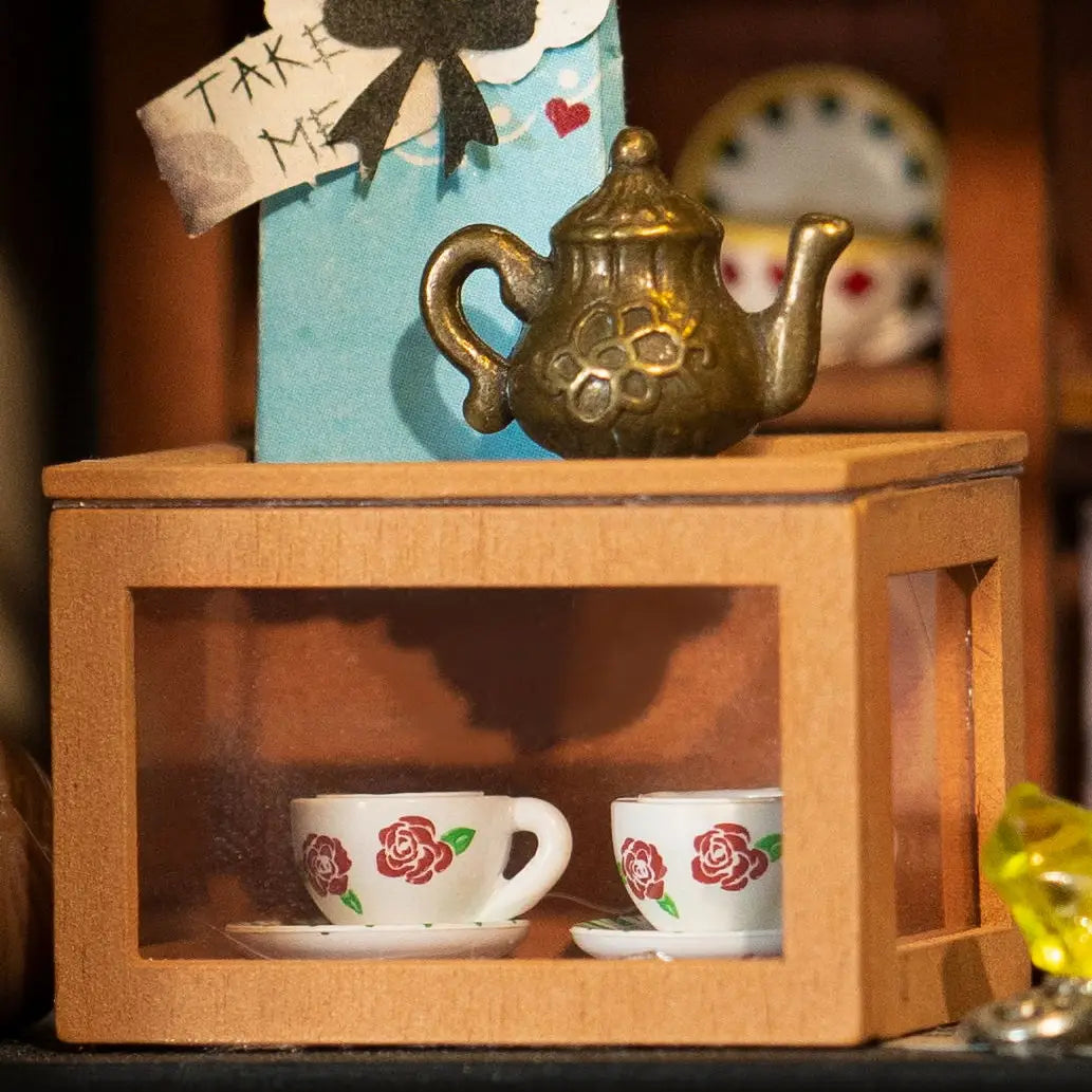 A whimsical DIY miniature dollhouse resembling a cat house with three floors, ideal for cats to eat, drink, and play. Dimensions: 11.4 x 7.7 x 2.8 in.