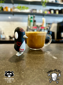 Toy penguin and coffee cup, part of Old Friend - Together Edition by Chris RWK.