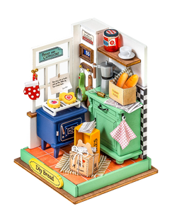 A miniature DIY house kit titled Afternoon Baking Time featuring a toy kitchen, oven, and food elements. Ideal for creative play. Dimensions: 5.3 x 2.2 x 5.9 in. From Strangecat Toys.