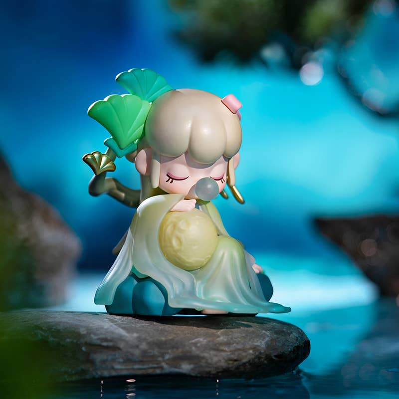 ZPXX Nanci series Poetic Beauty Doll Surprised Box featuring a figurine of a girl sitting on a rock, part of a blind box collection.