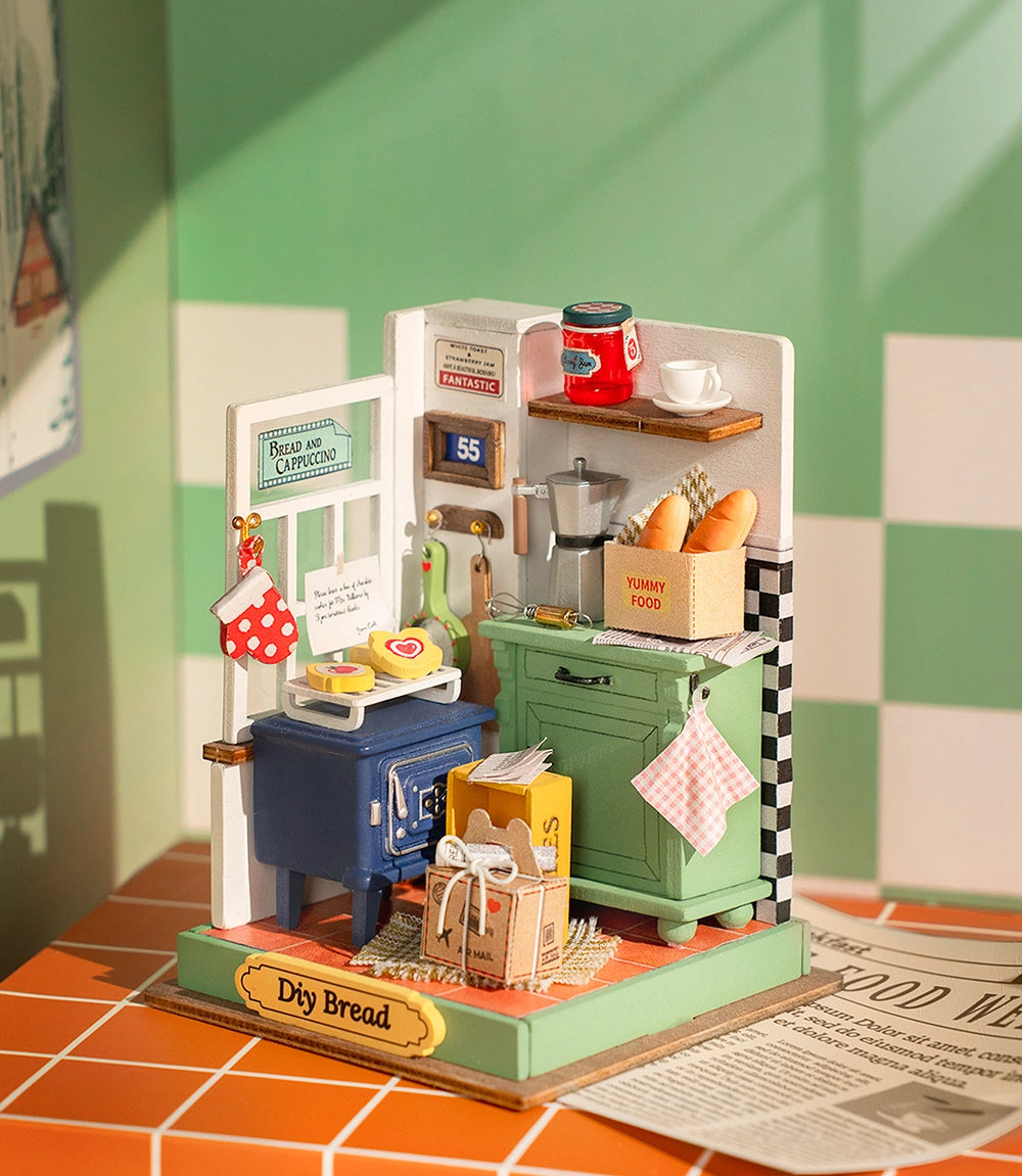 A toy kitchen scene with a stove, bread, and mini DIY house kit named Afternoon Baking Time. Perfect for DIY lovers, it's a unique gift and artistic home decor item. Dimensions: 5.9 x 5.3 x 2.1 in.