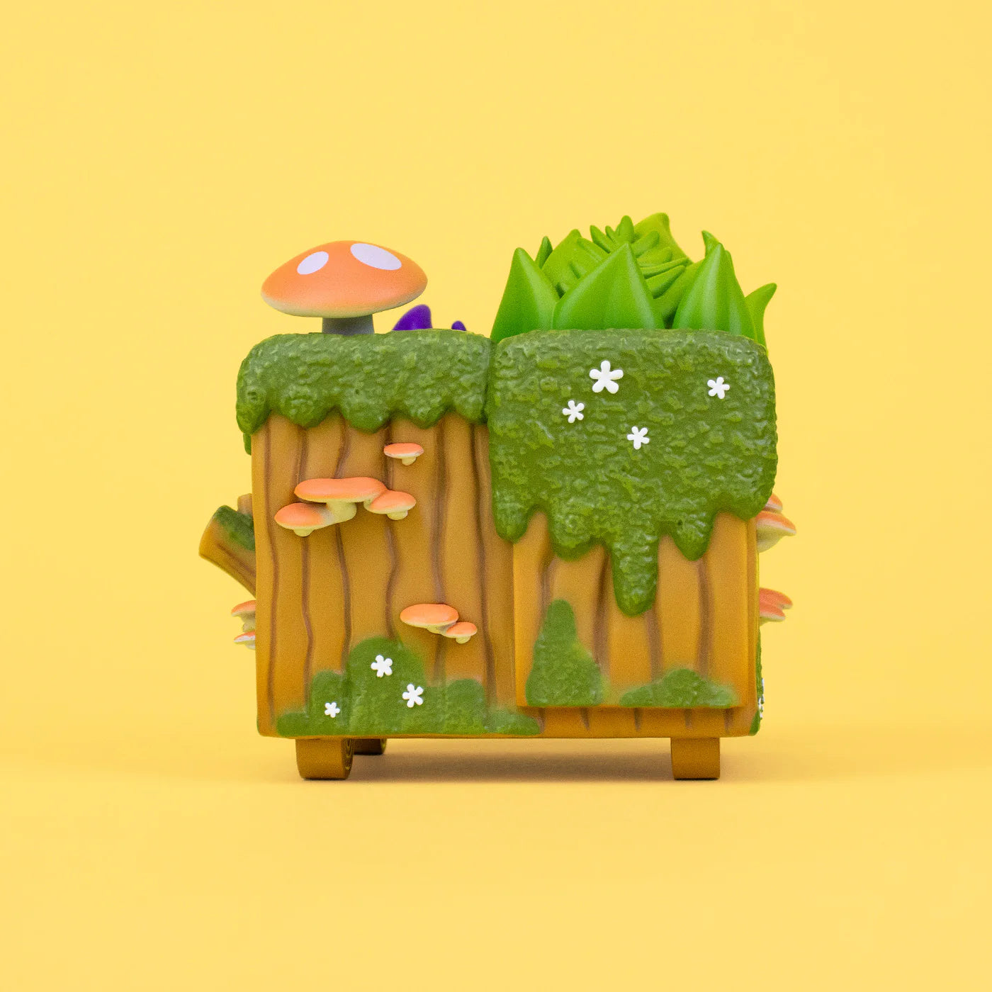 New Dumpster Stump Vinyl Figure featuring a toy planter with mushrooms and moss, designed with a toasted chocolate waffle cone body and mint chip ice cream texture.