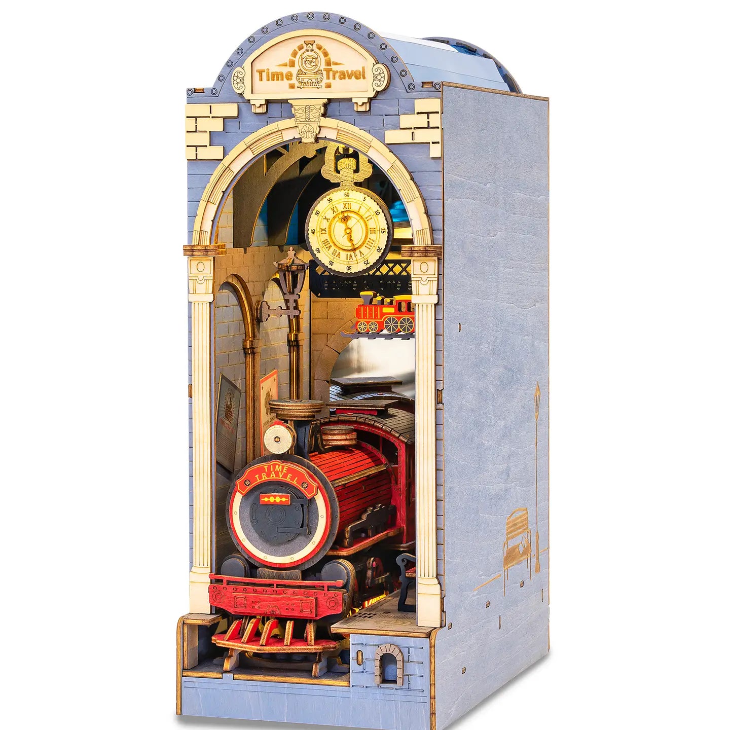 A DIY miniature house book nook featuring a toy train, clock, and train logo. Book Nook Kits For Adults - Time Travel. Dimensions: 9.1 x 12.2 x 1.8 in.