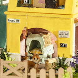 A DIY wooden dollhouse designed as a cat house with three floors for cats to eat, drink, and play. Perfect for feline friends.