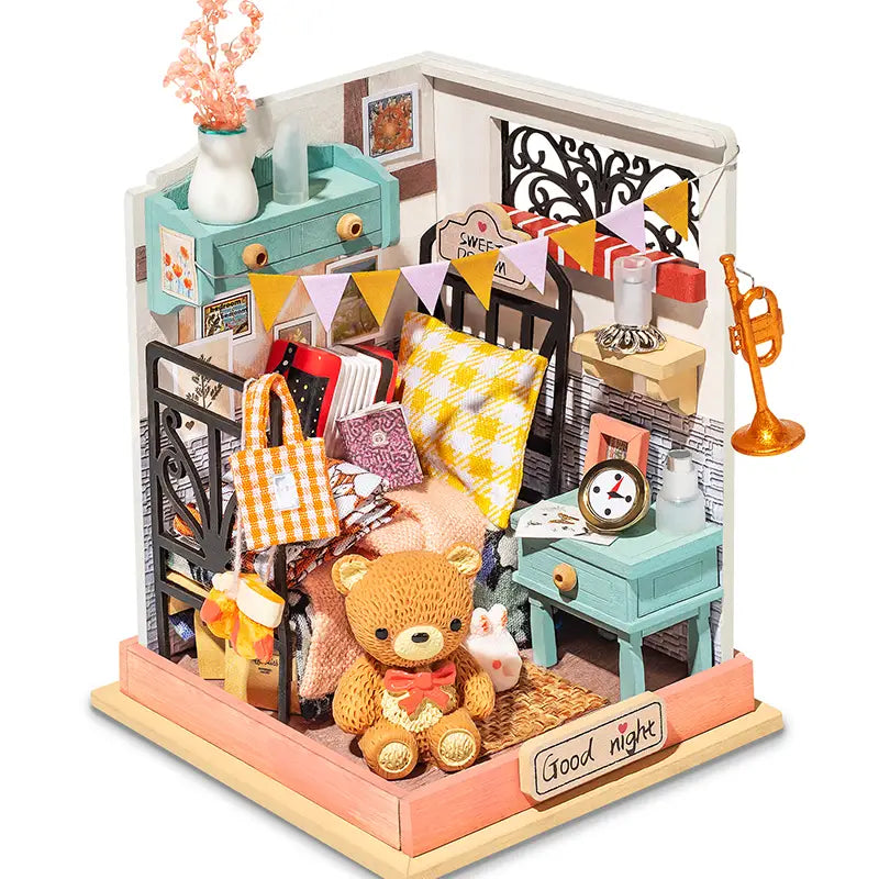 A DIY Sweet Dream -Bedroom Mini House kit with teddy bear, bed, clock, and bag. Ideal gift for DIY enthusiasts. Dimensions: 5.9 x 5.3 x 2.1 in.