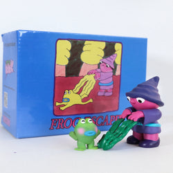 Toy figures including a frog, person with plant, and cartoon characters, part of Frog Escape by Life Machine - Preorder.