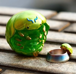 Beetle BOBO figurine next to a toy bowl, close-up details, 8.5 cm height.