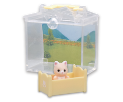 Sylvanian Families Decorative Baby House and Garden Gacha Series featuring a toy animal in a small crib, highlighting its detailed design.