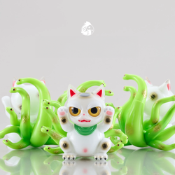 A group of small figurines featuring Meowthra, a white cat figurine with green tentacles and a green snake, a toy, a cartoon character logo, and a cat face close-up.