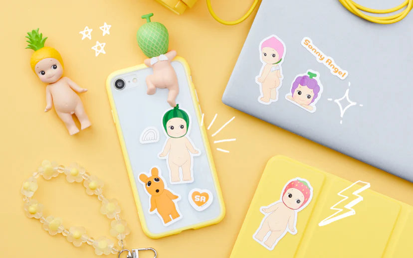 Sonny Angel Sticker Pack - Vol. 2 featuring cartoon characters and fruits, ideal for decorating phone cases and laptops with over 100 beloved designs.