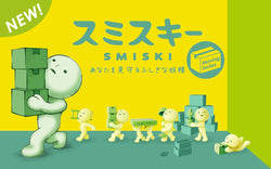 A cartoon character and small objects from Smiski Moving Series assisting in moving tasks.