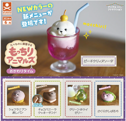 Close-up of Mochiri Animals Gacha toy with glass, straw, cupcake, and cookie in the image.