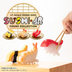 Hand holding chopsticks with Sushi Kaiju Sushi LA Real Sushi-Size Figure Collection, featuring detailed sushi figurines in a playful art toy style.