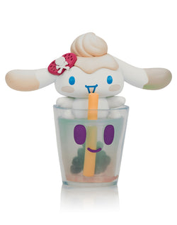 Tokidoki X Cinnamoroll Sweet Treats Blind Box featuring a toy figure with a skull and strawberry, captured in a whimsical winter-themed design.