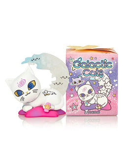 Toy cat on pillow next to box, Galactic Cats Blind Box Series, featuring extraterrestrial felines with celestial surprises.