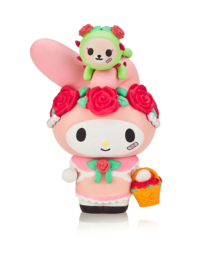 A toy figure of Kuromi holding a bunny with a basket of flowers from the tokidoki x Kuromi & My Melody Garden Party Blind Box Series.