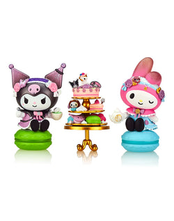 Tokidoki x Kuromi & My Melody Garden Party - Special Edition 2-pack figurines on a cake stand with various desserts, creating a tea party scene.