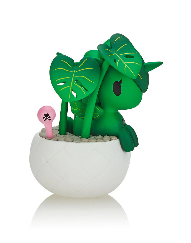 A green animal figure in a flowerpot, part of the Botanical Unicorno Blind Box Series by tokidoki. Features nine Unicorno/house plant hybrids like Aloe Vera and Fuchsia. Stands at 2.75 inches high.