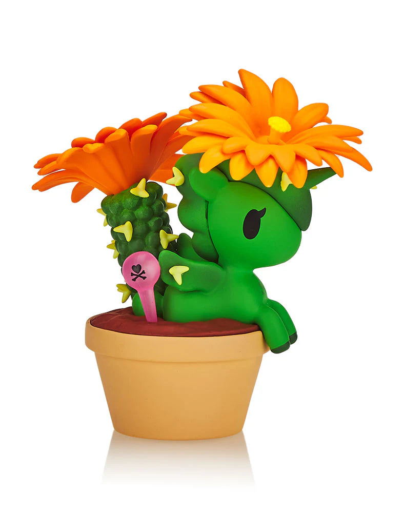 A blind box from Strangecat Toys: Botanical Unicorno series, featuring plant-themed Unicorno figures like Aloe Vera and Fuchsia. Each 2.75-inch character comes in a silver foil bag.