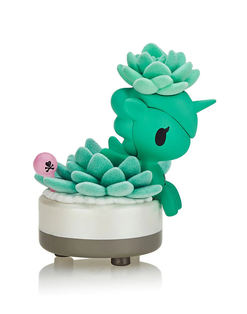 A Botanical Unicorno Blind Box Series toy featuring a green unicorn with plant-inspired designs. A blind box and art toy store exclusive by Strangecat Toys.