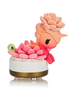 A blind box toy: Botanical Unicorno Blind Box Series by tokidoki. Features 9 Unicorno/house plant hybrids like Aloe Vera and Fuchsia. Approx. 2.75 inches high. Neon, metallic, and fuzzy details.