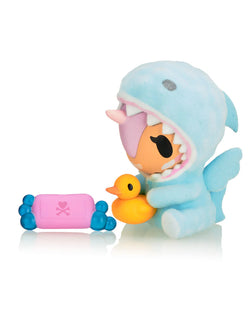 Cozy Unicorno Blind Box featuring a plush toy in a shark outfit, holding a small duck, part of a collectible art toy series from Strangecat Toys.