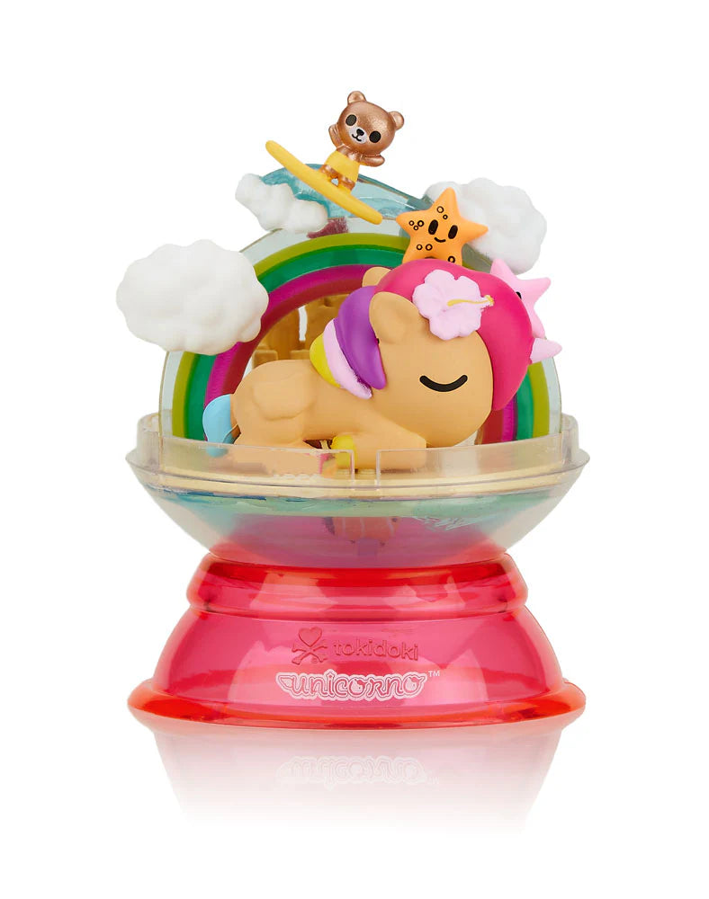 Dreaming Unicorno Blind Box featuring toy unicorns in a removable dome, displaying a magical dreamland with rainbow and clouds elements.