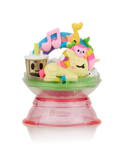 Dreaming Unicorno Blind Box featuring a yellow unicorn toy in a dome, part of a series with nine collectible characters.