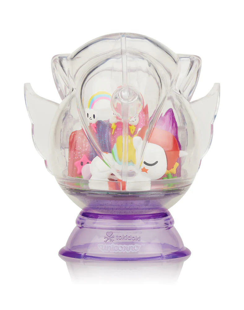 Dreaming Unicorno Blind Box featuring a clear dome with a removable toy Unicorno inside from Strangecat Toys.