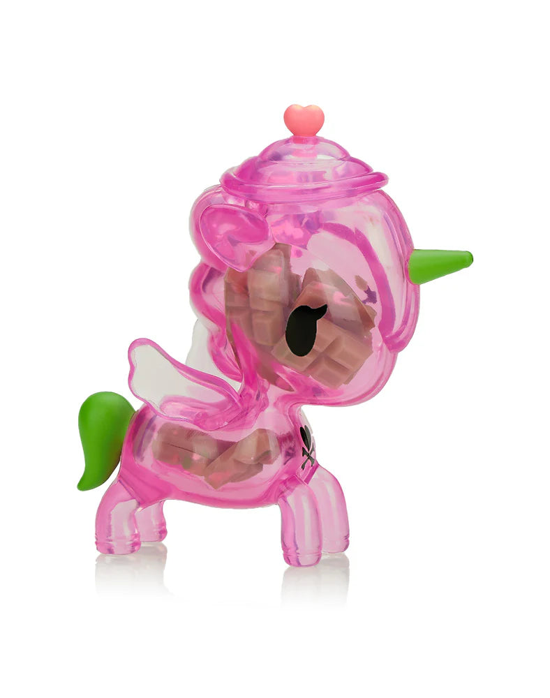 Sugar Shop Unicorno Blind Box featuring a pink plastic unicorn with dual horns, enclosed in a clear candy jar with visible candy shapes inside.