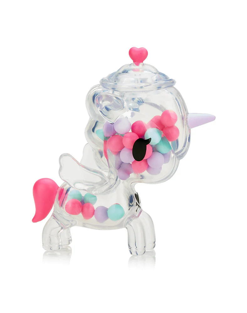 Sugar Shop Unicorno Blind Box featuring a plastic unicorn filled with candy-shaped pieces, symbolizing the surprise and collectible nature of blind box art toys.