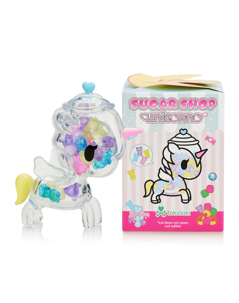 Sugar Shop Unicorno Blind Box featuring a plastic unicorn toy resembling a candy jar, alongside a box and colorful gummy bear pieces.