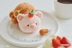 Stuffed pig keychain with strawberry nose on plate, close-up of coffee cup, and food close-up.