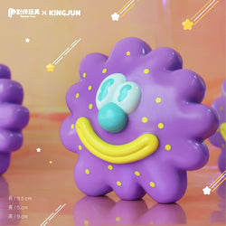 A close-up of a unique toy by Kingjun, featuring a cartoon virus flower design.