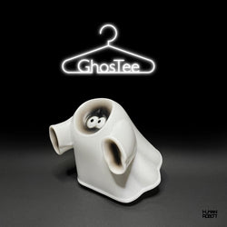 GhosTee by Human Robot Sofubi figure with cartoon character eyes and neon sign details.