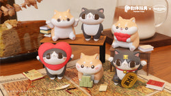 Marshmallow shiba and lazy cat figurines in Blind Box Series - Preorder, with toy animals and souvenirs on a table.